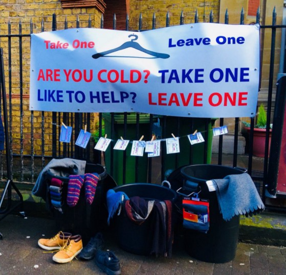 Good idea to share: A Give One Take One rail offering coats, gloves and vouchers from local shops for free coffees, sandwiches and haircuts. This was operating in Exmouth Market, London. It reached 35,000 people on Facebook. © the Pavement