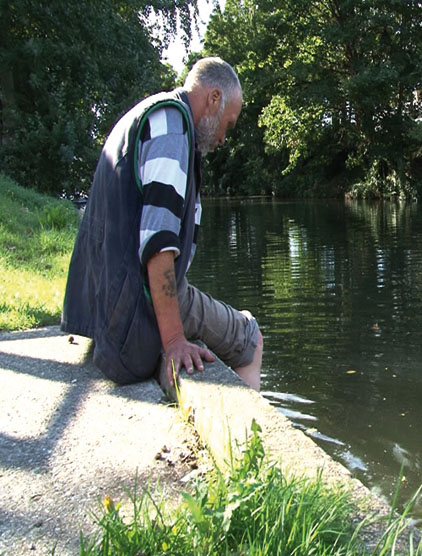 Peter cools his feet in a canal. Photo: Paddy Steel