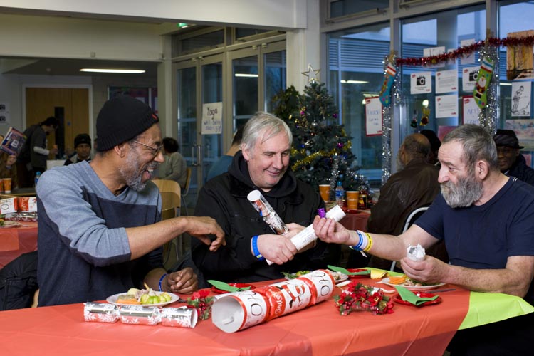 Guests at Crisis at Christmas 2013 get into the festive spirit. © Crisis