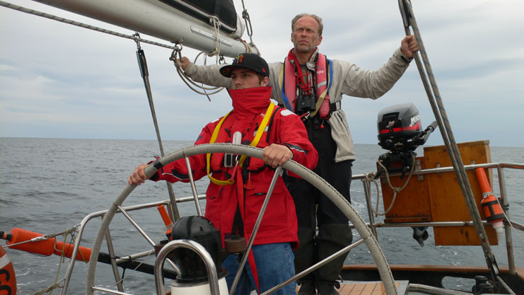 John Scarfe, OYT volunteer, watching Jordan Davies at the helm. ¬¨¬© Cyrenians