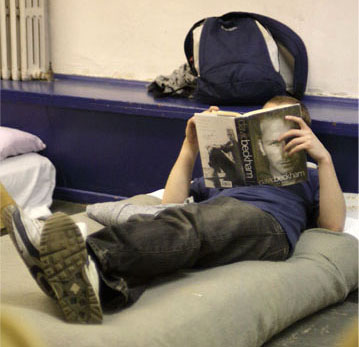 A mat on the floor and a blanket – it's basic but better than the streets. © Patrick Gorman